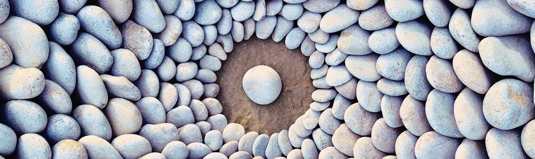 Smooth grey stones arranged in a circle